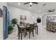 Open-concept living area features neutral walls, marble floors, and comfortable seating at 675 S Cedar Ave, Orange City, FL 32763