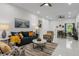 Spacious living room with a blend of modern décor, marble floors and comfortable furniture at 675 S Cedar Ave, Orange City, FL 32763