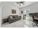 Office space featuring a comfortable sofa, desk, and large window, creating a functional workspace at 675 S Cedar Ave, Orange City, FL 32763