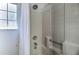 This bathroom offers a shower with a detachable shower head and bright natural light at 730 Bloomingdale Dr, Davenport, FL 33897