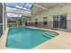 Backyard screened-in pool features a safety fence, making it ideal for a Gathering with  at 730 Bloomingdale Dr, Davenport, FL 33897
