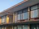 Exterior view of a multi-story building featuring small balconies with black metal railings at 7900 S Orange Blossom Trl # 2025, Orlando, FL 32809