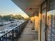 Exterior view from a walkway of the building and parking lot during the day at 7900 S Orange Blossom Trl # 2025, Orlando, FL 32809