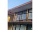Exterior view of a multi-story building featuring small balconies with black metal railings at 7900 S Orange Blossom Trl # 2025, Orlando, FL 32809