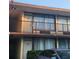 Exterior view of a multi-story building featuring small balconies with black metal railings at 7900 S Orange Blossom Trl # 2025, Orlando, FL 32809