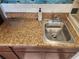 Close-up shot of kitchen countertop and sink at 7900 S Orange Blossom Trl # 2025, Orlando, FL 32809