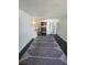 Living room area featuring an accent rug, table, and lamp at 7900 S Orange Blossom Trl # 2025, Orlando, FL 32809