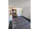 Cozy living area with tile flooring, rug, and a compact kitchenette at 7900 S Orange Blossom Trl # 2025, Orlando, FL 32809