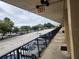 Balcony view overlooking a large parking lot with many parked cars on a cloudy day at 7900 S Orange Blossom Trl # 2025, Orlando, FL 32809