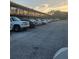 Ample parking spaces with a view of the building's exterior at 7900 S Orange Blossom Trl # 2025, Orlando, FL 32809