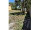 View of the backyard, featuring a shed and a wooded fence at 8 E Summit St, Apopka, FL 32712