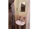 Bathroom features a tiled shower, a sink with a mirror and soap at 8 E Summit St, Apopka, FL 32712