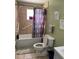 Standard bathroom with tiled walls, open toilet, and decorative shower curtain at 8 E Summit St, Apopka, FL 32712