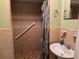 Bathroom features a tiled shower, a sink with a mirror and soap at 8 E Summit St, Apopka, FL 32712