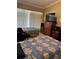 Bright bedroom with two twin beds, tile flooring, and a closet for storage at 8 E Summit St, Apopka, FL 32712