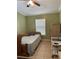 Bedroom features a bed, tiled floors, and window with blinds at 8 E Summit St, Apopka, FL 32712