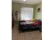 Cozy bedroom featuring fun decor, natural light, and playful accents at 8 E Summit St, Apopka, FL 32712
