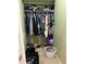 Walk-in closet with organized clothing racks, shoes and other items for storage at 8 E Summit St, Apopka, FL 32712