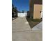 View of driveway leading into property showing a white fence at 8 E Summit St, Apopka, FL 32712