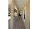 Covered front porch with classic columns, neutral paint, and view to front yard and landscaping at 8 E Summit St, Apopka, FL 32712