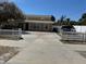 Home exterior with white picket fence, spacious front yard, and ample parking space at 8 E Summit St, Apopka, FL 32712