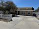 Exterior of a home with lush tree, a well-manicured front yard, and driveway at 8 E Summit St, Apopka, FL 32712