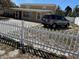 Home exterior with white picket fence, front yard, and parked car at 8 E Summit St, Apopka, FL 32712
