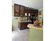 A kitchen with dark wood cabinets and a microwave at 8 E Summit St, Apopka, FL 32712