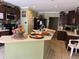 A kitchen with dark cabinets and stainless steel appliances at 8 E Summit St, Apopka, FL 32712