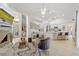 Open-concept living room, seamlessly connects to a bright kitchen with a modern fireplace at 8453 Firefox Cv, Orlando, FL 32835