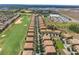 Aerial view featuring residential buildings, a golf course, and well-maintained grounds at 8925 Azalea Sands Ln # 602, Davenport, FL 33896
