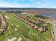 Stunning aerial view of a golf course community with lush greenery and well-maintained homes under a bright sky at 8925 Azalea Sands Ln # 602, Davenport, FL 33896