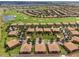 Panoramic aerial view of residential buildings, golf course, and lush landscaping at 8925 Azalea Sands Ln # 602, Davenport, FL 33896