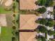 Aerial view showcasing the roof of the home within a beautifully landscaped golf community at 8925 Azalea Sands Ln # 602, Davenport, FL 33896