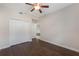 Bedroom with hardwood floors, a ceiling fan, and closet space at 8925 Azalea Sands Ln # 602, Davenport, FL 33896