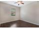 Bedroom with hardwood floors, ceiling fan, and a window at 8925 Azalea Sands Ln # 602, Davenport, FL 33896