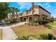 Charming townhouse exterior showcasing the attached garages, manicured landscaping and inviting curb appeal at 8925 Azalea Sands Ln # 602, Davenport, FL 33896