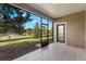 The patio showcases a scenic view of the lawn and mature trees, with a tiled floor at 8925 Azalea Sands Ln # 602, Davenport, FL 33896