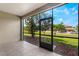 Patio with tile flooring and a serene view of the green lawn and mature trees at 8925 Azalea Sands Ln # 602, Davenport, FL 33896