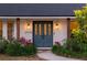 Close up front entrance featuring double doors, wooden beams, and manicured landscaping at 29540 Deerwood Farms Rd, Sorrento, FL 32776