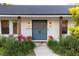 Inviting front entrance with stylish double doors, brick accents, and lush plants at 29540 Deerwood Farms Rd, Sorrento, FL 32776