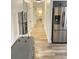 Hallway with hardwood flooring connecting different areas of the house at 29540 Deerwood Farms Rd, Sorrento, FL 32776