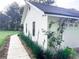 White brick home with a green lawn and a long concrete walkway at 29540 Deerwood Farms Rd, Sorrento, FL 32776