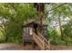 Charming two-story treehouse with a viewing platform, offering a playful retreat at 29540 Deerwood Farms Rd, Sorrento, FL 32776