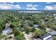Beautiful aerial view of the property nestled amongst mature trees and with close proximity to the lake at 105 Valley Ct, Longwood, FL 32779