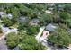 Aerial view of the property nestled amongst mature trees and with close proximity to neighbors at 105 Valley Ct, Longwood, FL 32779