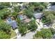 An aerial view of the property nestled amongst mature trees and with close proximity to neighbors at 105 Valley Ct, Longwood, FL 32779