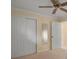 Bedroom with carpeted floor, closet with sliding doors, and ceiling fan at 105 Valley Ct, Longwood, FL 32779