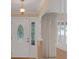 View of the foyer with a white front door that features an oval decorative glass insert at 105 Valley Ct, Longwood, FL 32779