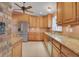 Spacious kitchen with stainless steel appliances, granite countertops, and ample cabinet space at 105 Valley Ct, Longwood, FL 32779